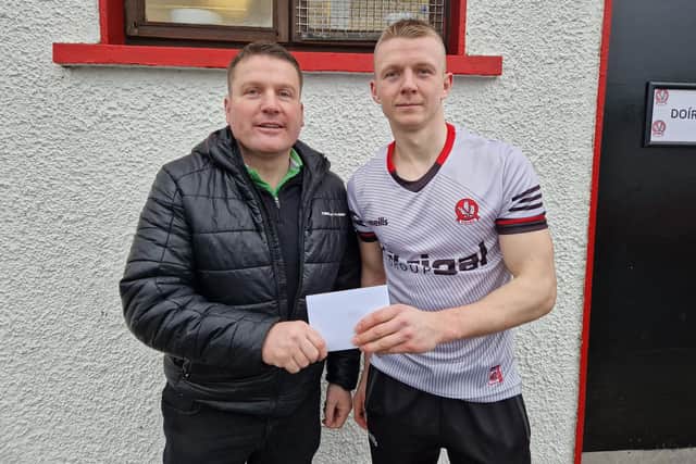 Dermot Friel of Friel's Bar, Swatrgh presents 'Man of the Match' Corey O'Reilly with a voucher after the Derry forward hit 1-04 in Sunday's league victory over Tyrone in Celtic Park.
