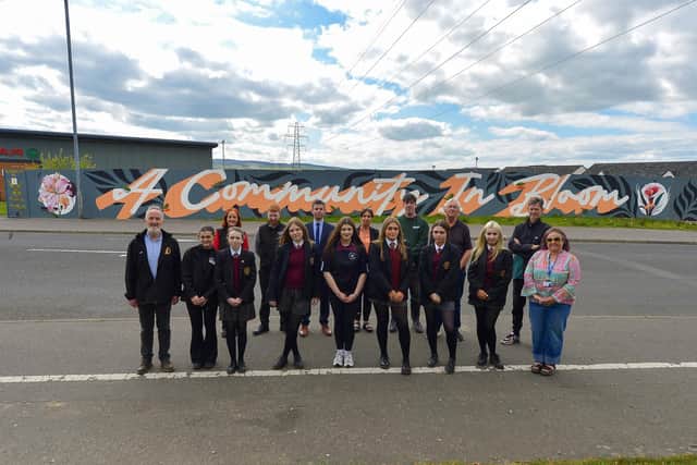 Pictured at the launch of the Glenabbey Art/Mural project, adjacent to Lynch’s Eurospar, are Year 10 students from St Brigid’s College who participated in the project, Cathal Crumley,  Co-ordinator CRJ, staff from Lynch’s Eurospar, Sean McCay, VP of St Brigid’s College, Martina McFadden, Assistant Learning Co-ordinator St Brigid’s School, Mark Payne, Peaball Collective, Martin Gallagher, DSSDC Good Relations Officer, Donal Doherty, Peaball Collective and Sinn Fein Colr Amanda Clarke.  Photo: George Sweeney