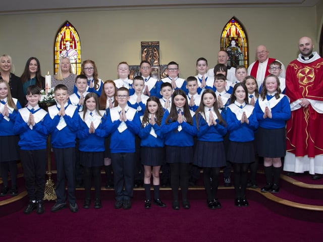 Children from St. Paul’s PS, Slievemore who received the Sacrament of Confirmation from Fr. McDermott at St. Joseph’s Church, Galliagh on Friday afternoon last. Included from left are Ms. Claire McGinty, P7 teacher, Ms. Kelsie McCourt, student teacher and Mrs. Audrey Lynch, Classroom Assistant, and on right, Fr. Sean McCallion and Fr. Michael McGaughey. (Photo: Jim McCafferty Photography)