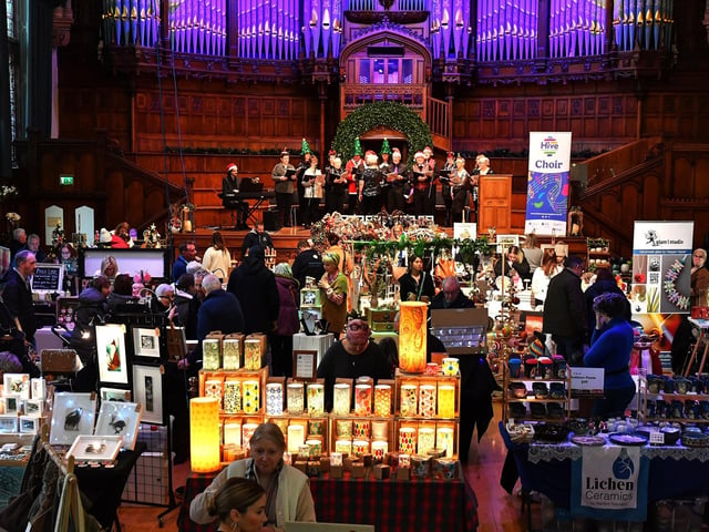 People browse the large range of gifts at the Guildhall Christmas Fair on Friday afternoon. Photo: George Sweeney / Derry Journal