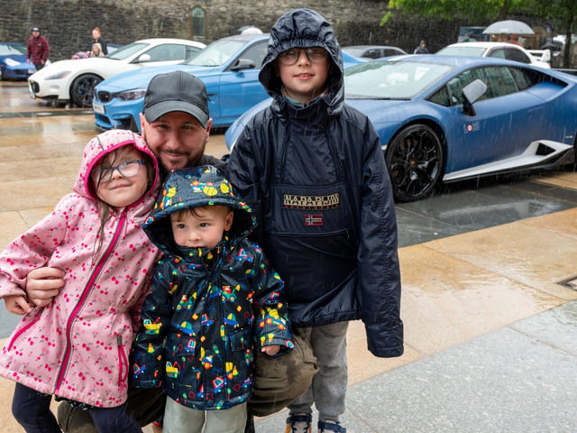 Maisie , Theo and Maverick Mathewson with dad Michael. Derry City and Strabane District Council Mayor, Councillor Lilian Seenoi-Barr has hosted Supercar Saturday in Guildhall Square to raise money for the Mayoral Charity Bud Club. The event attracted car enthusiasts and owners from across the region to support aid the local charity. Picture Martin McKeown. 24.05.25