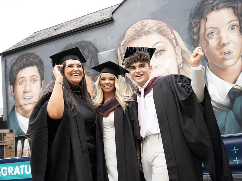 Aine Healy (Law), Lauren McCreight (Law with Irish) and Brent Hutchinson (Law) celebrate as they graduate from Ulster University in Derry on Monday July 8. (Photo: Nigel McDowell / Ulster University)