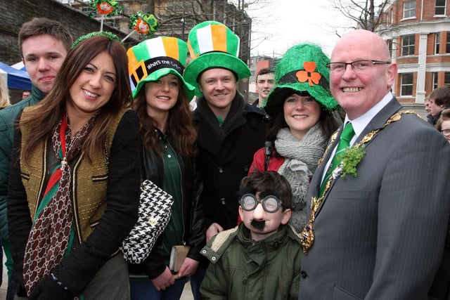 The Mayor of Derry Councillor Kevin Campbell, with the Heaney family and friends from Derry, on his tour of Guildhall Square during the St. Patrick’s Day celebrations on Sunday.