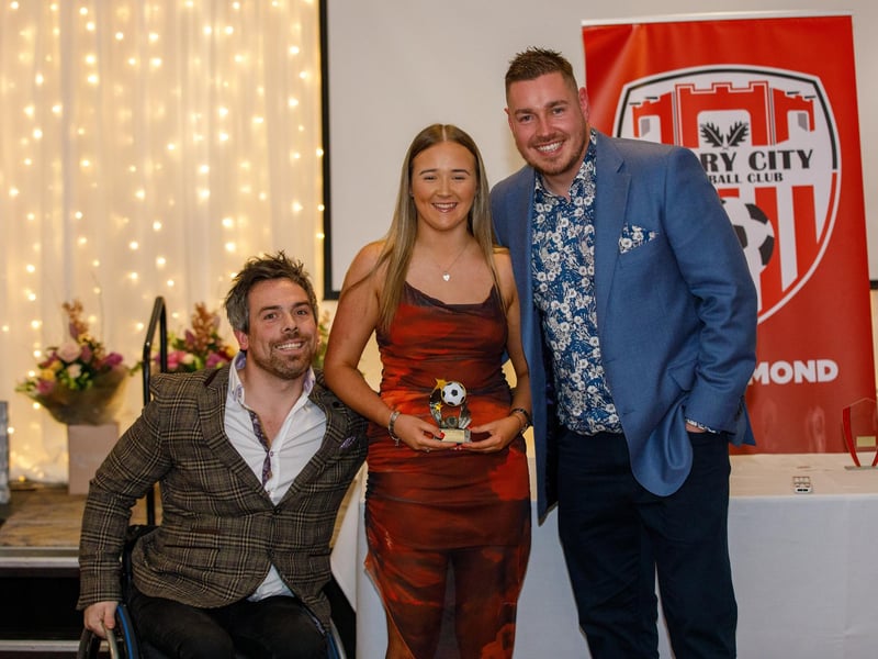 Ellie Long receives the best newcomer award from coach Pete Mitchell and manager Paul Dixon. Ellie had a terrific first season with the club which included a great individual goal in the Irish Cup semi-final.