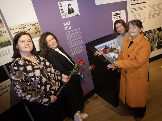 Celebrating International Women's Day at the Gasyard Centre on Tuesday are, from left, Maureen Collins, Linda McKinney, manager, Gasyard Development Trust, Jayne Quigg, manager, DHCT, and Eileen Allen, chair, DHCT beside the portrait of Mary Nelis.