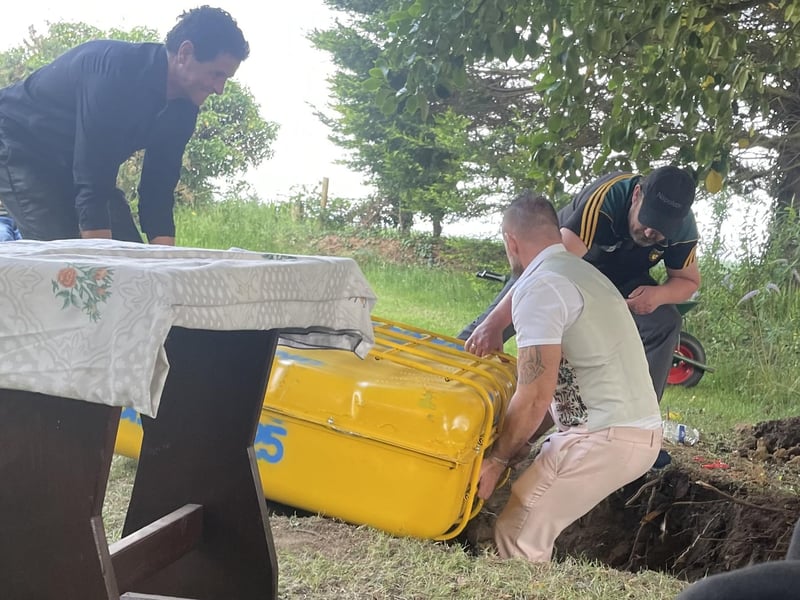 Abbi's memory book and time capsule being buried on the Summer Solstice.