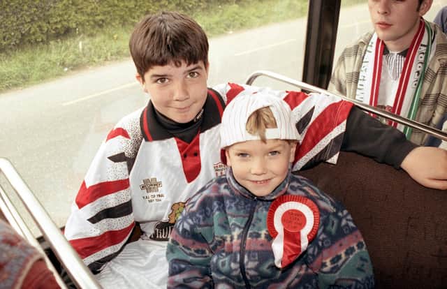 Brendan Deane and his nephew making their way to the FAI Cup Final in 1994 against Shelbourne. Photos by Hugh Gallagher