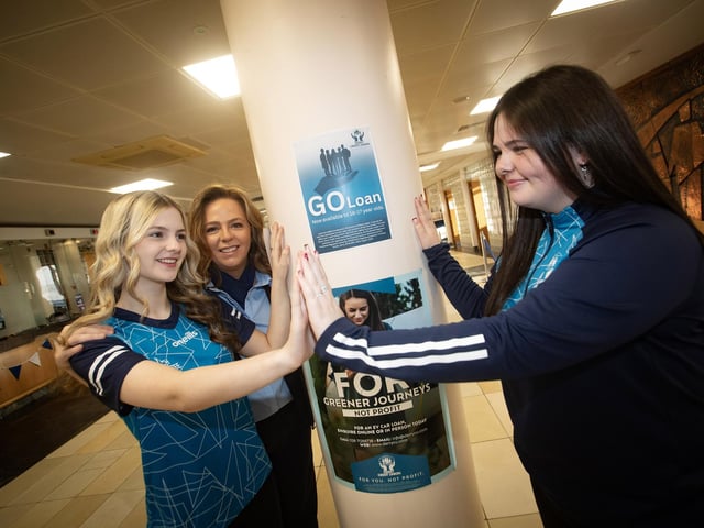 Mum and CU staff member Sharon Doherty with daughters Sarah and Abbie during Saturday's International Credit Union Day at Derry Credit Union. : .