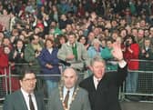 November 30, 1995 Derry:  US President Bill Clinton waves at the crowd after a walk in Derry with John Hume and then Mayor John Kerr. (LUKE FRAZZA/AFP via Getty Images)
