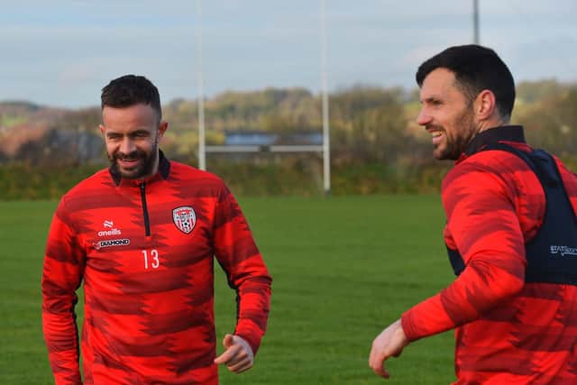 Derry City players Robbie Benson and Pat Hoban training at the GAA Centre of Excellence, Owenbeg, on Monday morning.  Photograph: George Sweeney