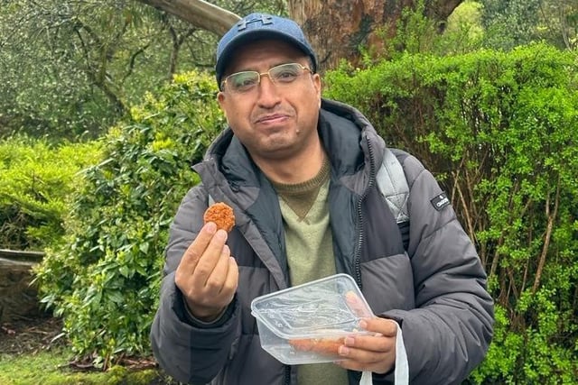 Abdulelah Sallam enjoying a bite to eat during the North West Migrants Forum trip to Belfast zoo on Saturday.