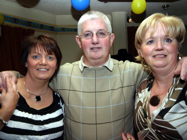 Michael poses for the photographer with his sisters, Jean and Anne 0026/JML : Parties and celebrations January 2006: Michael Rankin.