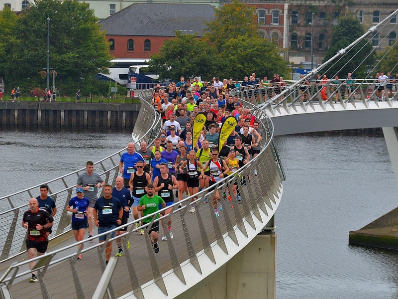 The 2024 Waterside Half Marathon competitors make their way across the Peace Bridge. Photo: George Sweeney