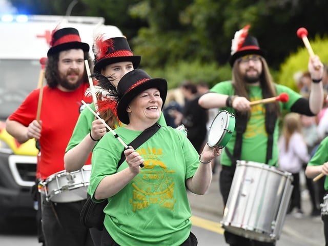 Muff Feile opening parade makes its way through the village on Friday evening. Photo: George Sweeney