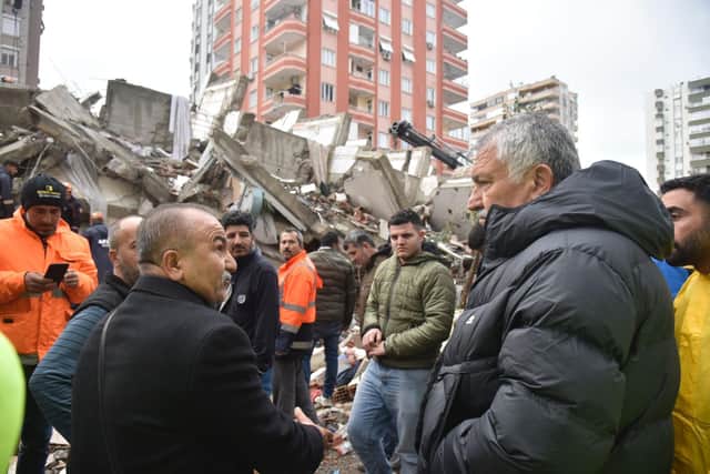 The Mayor of Adana, Keydan Karalar, talks to citizens in the aftermath of Monday's devastating earthquakes.