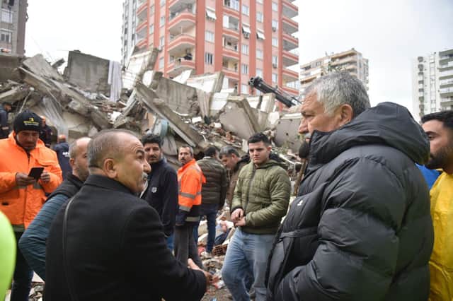 The Mayor of Adana, Keydan Karalar, talks to citizens in the aftermath of Monday's devastating earthquakes.
