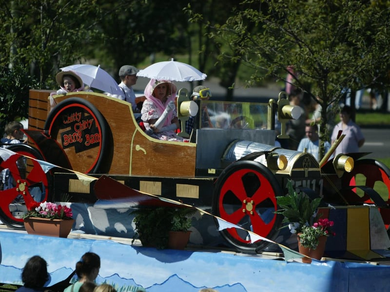 Chitty Chitty Bang Bang takes a lift during the festival parade. (2608JB44)