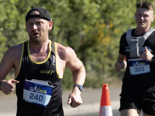 Richard Duffy [Omagh Harriers] sets off on the Strabane Lifford Half Marathon with Jason Gallagher [unattached] close behind.