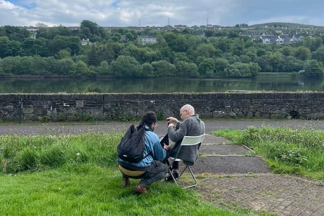 Adrián Balseca filming ‘Nyctalopia’ (2024) with Eamonn McCann. Taken by Sinéad Feeney.