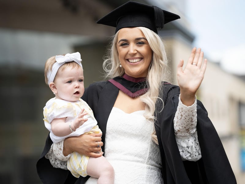 Law graduate Lauren Thompson from Derry celebrates with her daughter Lucia Thompson (aged 9 months) as she graduates from Ulster University in Derry on Monday July 8.  (Photo: Nigel McDowell / Ulster University)