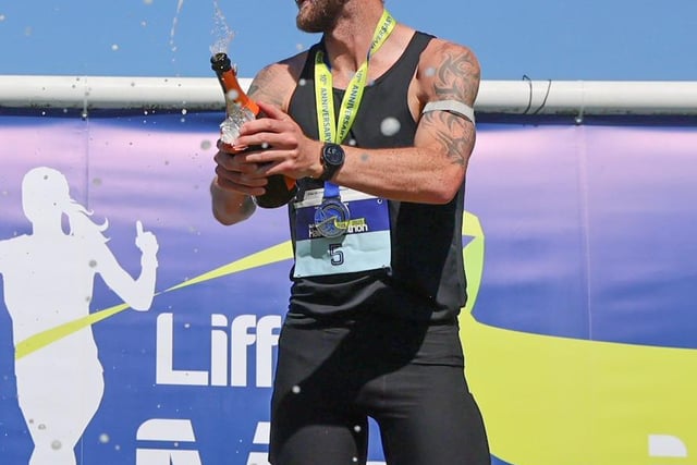 Stephen McCauley of Letterkenny AC celebrates his winning performance on the podium.