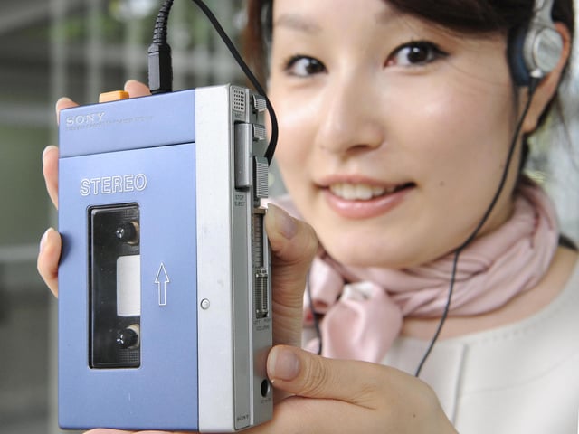 In the late 80s the coolest cats in town were those with their very own personal cassette player. Here an employee of Japan's electronics giant Sony displays the first model of Sony's stereo cassete player Walkman TPS-L2 from thew 1980s. Sony sold 50 million Walkmans within a decade. (YOSHIKAZU TSUNO/AFP via Getty Images)
