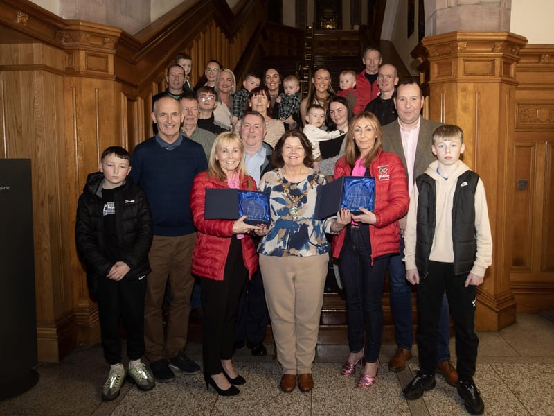 McMONAGLE SISTERS RECOGNISED. . . . . Sisters Paula McGilloway and Jaqqueline McMonagle pictured on Thursday night last in the Guildhall being presented with awards in recognition of their recent athletics achivements running for Ireland in the British and Irish Masters Invitational in Glasgow - Paula, silver medal winner and Jacqueline, gold medal winner. Included are their family and friends. (Photos: Jim McCafferty Photography)