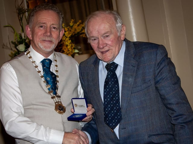 Derry Credit Union's Leo Simpson receives a special presentation in recognition of his 50 years service from the President of the Irish League of Credit Unions.