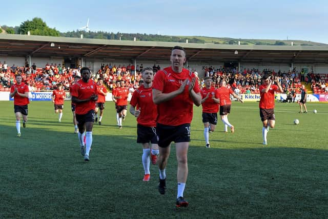 Shane McEleney leads the Derry City team into the dressing room at Brandywell.