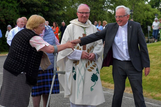 Fr Con McLaughlin PP is greeted by a parishioner after Mass, at the Church of the Sacred Heart, Carndonagh, on Saturday evening, to mark the occasion of his Golden Jubilee in the priesthood.  Photo: George Sweeney. DER2323GS – 164