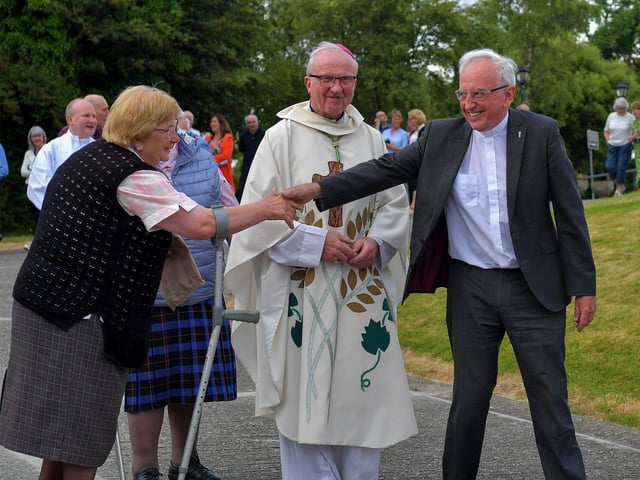 Fr Con McLaughlin PP is greeted by a parishioner after Mass, at the Church of the Sacred Heart, Carndonagh, on Saturday evening, to mark the occasion of his Golden Jubilee in the priesthood. Photo: George Sweeney. DER2323GS – 164