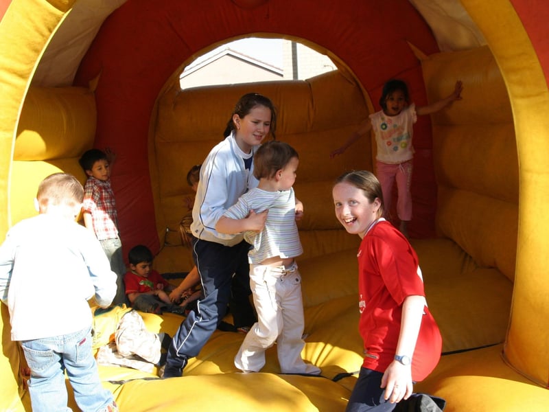 Friends together on the bouncy castle.