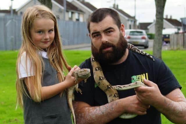 Dennis Dunn from Repti Rescue NI with his daughter Ellie.