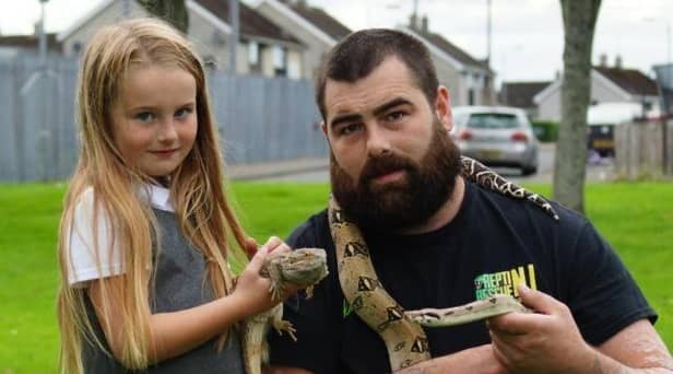 Dennis Dunn from Repti Rescue NI with his daughter Ellie.