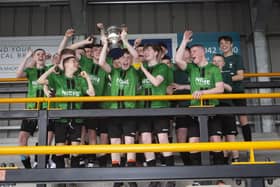 VICTORIOUS!!!!. . . St. Joseph’s Boys School captain Shea McGinley proudly lifts aloft the trophy on Friday. (Photos: Jim McCafferty Photography)