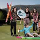 Competition judge and award-winning artist,  Kathryn Callaghan and Tourism NI Communications Officer, Claire Hamilton along with budding young artists at the launch of the Giant Welcome Art Competition