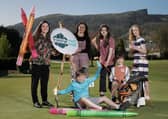 Competition judge and award-winning artist,  Kathryn Callaghan and Tourism NI Communications Officer, Claire Hamilton along with budding young artists at the launch of the Giant Welcome Art Competition