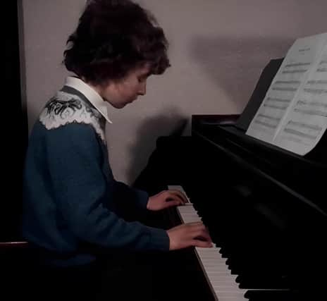 Ronan pictured playing the piano that eventually became the property of Johnny McDaid of Snow Patrol fame.