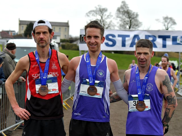 Allan Bogle, City of Derry Spartans, second place, Scott Rankin, Foyle Valley, winner, and Matthew McLaughlin, Foyle Valley, took third place in the Bentley Group Derry 10 Miler road race on Saturday morning. Photo: George Sweeney. DER2310GS – 112