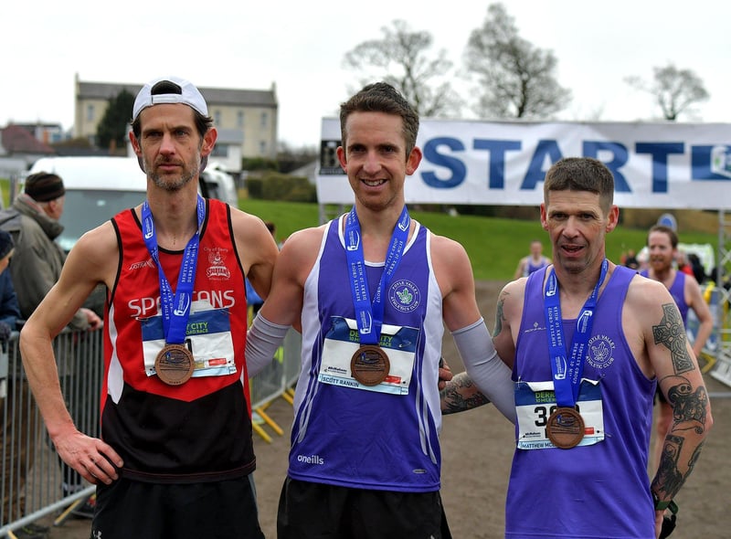 Allan Bogle, City of Derry Spartans, second place, Scott Rankin, Foyle Valley, winner, and Matthew McLaughlin, Foyle Valley, took third place in the Bentley Group Derry 10 Miler road race on Saturday morning. Photo: George Sweeney. DER2310GS – 112