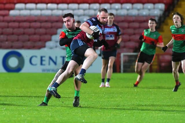 Caelan O’Connell of Doire Trasna grapples with Glack’s Thomas O’Kane during Friday evening’s JFC quarter-final in Celtic Park. Photo: George Sweeney