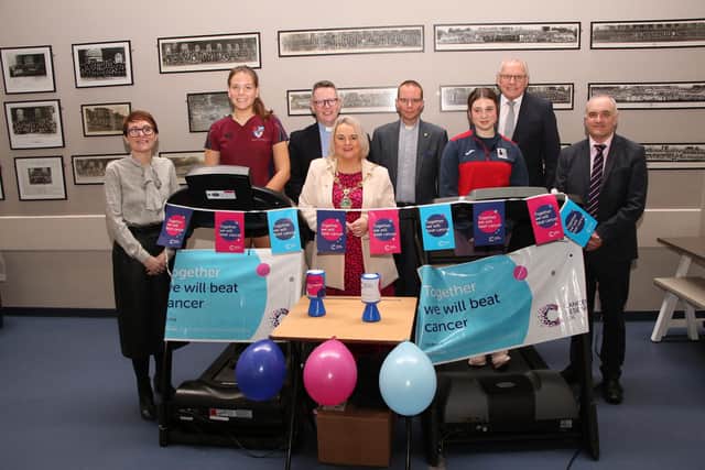 Foyle College student Megan Cairns and Lisneal student Katie McArthur who participated in a treadmill marathon in aid of Cancer Research UK, at the school on Wednesday morning, pictured with Mayor Sandra Duffy and, from left, vice-principal Deirdre McLaughlin, Archdeacon Robert Miller, Chair of the Board of Governors, the Rev Nigel Cairns, father of Megan, Deputy Lieutenant for the County Borough of Londonderry, Ian Crowe MBE Lord-Lieutenant for the County Borough of Londonderry and Lisneal principal Michael Allen. Photo: George Sweeney. DER2308GS – 94.