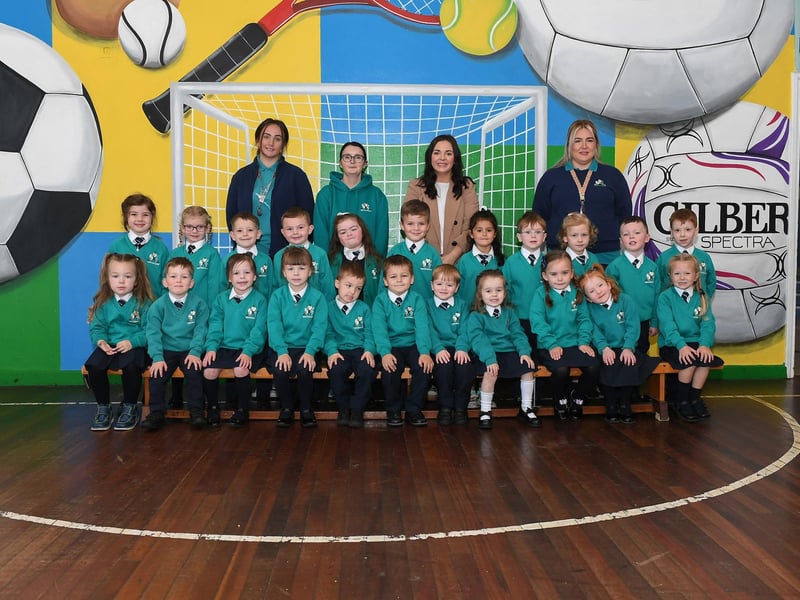Mrs Convery, second from right, with her P1 class at Glendermott Primary School.  Included in the photo are classroom assistants Ms Heather, Ms McColgan and Ms Brolly.