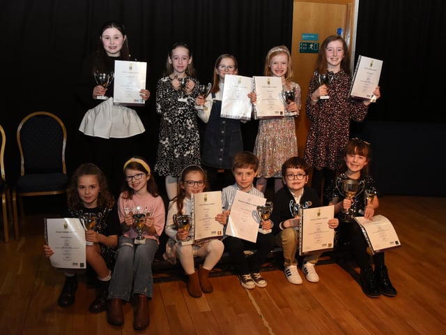 The junior class group displaying their Trinity College London singing examination certificates that were presented to them at last week's Charity. Feis.