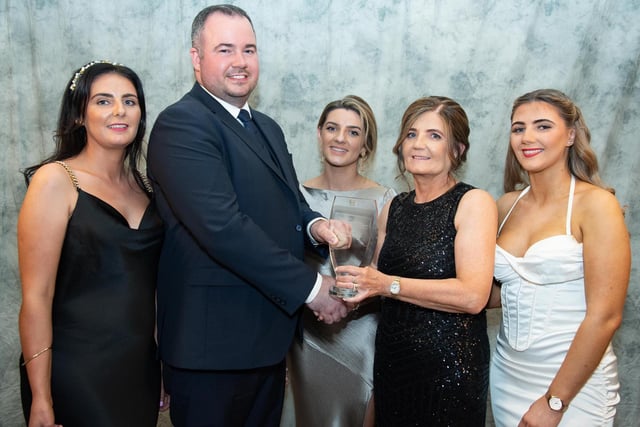 Davin Doherty, presents the Buncrana Bottling sponsored  Eatery of the Year Award to the Diamond Cafey from left are  Donna Hegarty, Tanya McLaughlin, Anne McLaughlin and Kievea McLaughlin collects   at the Carndonagh Traders Business and Community Awards in the Ballyliffin Lodge Hotel on Saturday night last. Photo Clive Wasson.