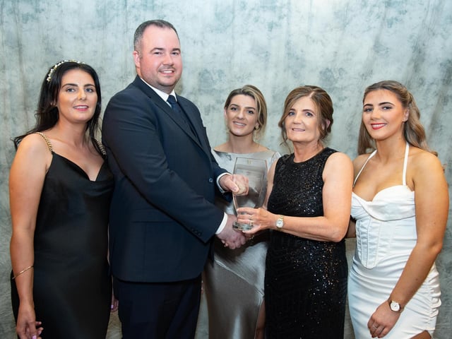 Davin Doherty, presents the Buncrana Bottling sponsored Eatery of the Year Award to the Diamond Cafey from left are Donna Hegarty, Tanya McLaughlin, Anne McLaughlin and Kievea McLaughlin collects at the Carndonagh Traders Business and Community Awards in the Ballyliffin Lodge Hotel on Saturday night last. Photo Clive Wasson.