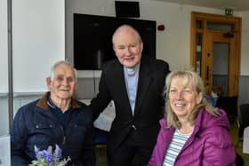 Pat and Dolores Scullion pictured with Father Gerard Mongan, Administrator, Long Tower Church, in the Cloisters Café based in Aras Cholmcille. Photo: George Sweeney