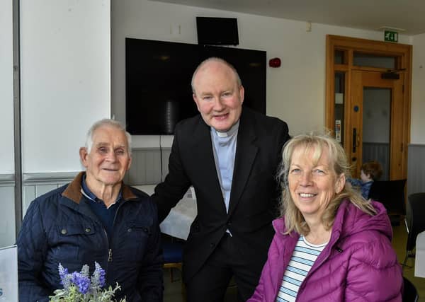 Pat and Dolores Scullion pictured with Father Gerard Mongan, Administrator, Long Tower Church, in the Cloisters Café based in Aras Cholmcille. Photo: George Sweeney
