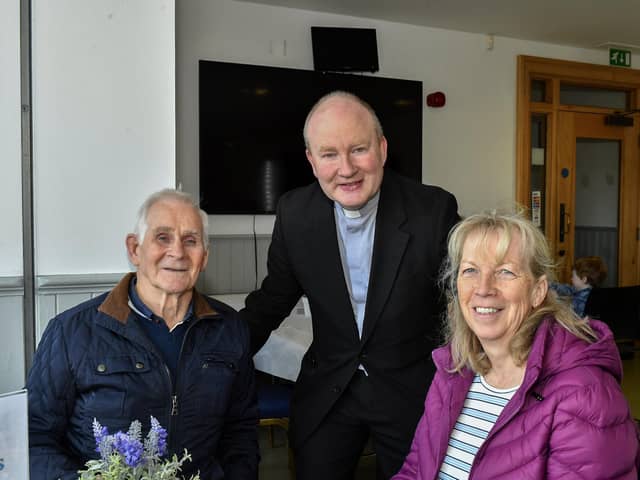 Pat and Dolores Scullion pictured with Father Gerard Mongan, Administrator, Long Tower Church, in the Cloisters Café based in Aras Cholmcille. Photo: George Sweeney