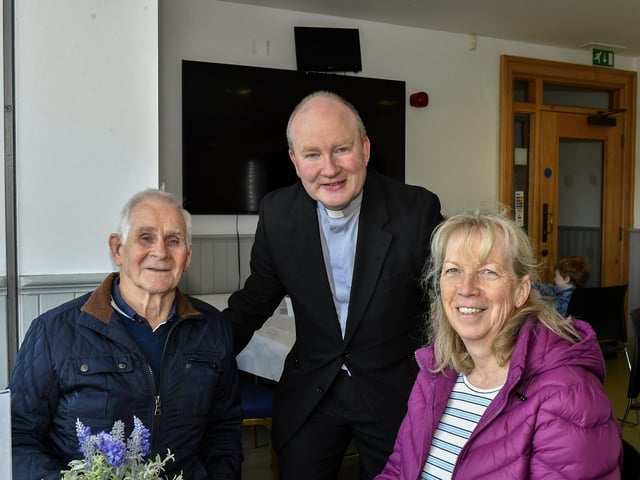 Pat and Dolores Scullion pictured with Father Gerard Mongan, Administrator, Long Tower Church, in the Cloisters Café based in Aras Cholmcille. Photo: George Sweeney